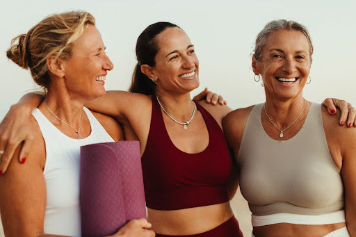 three midlife women wearing athletic wear for the menopause shake
